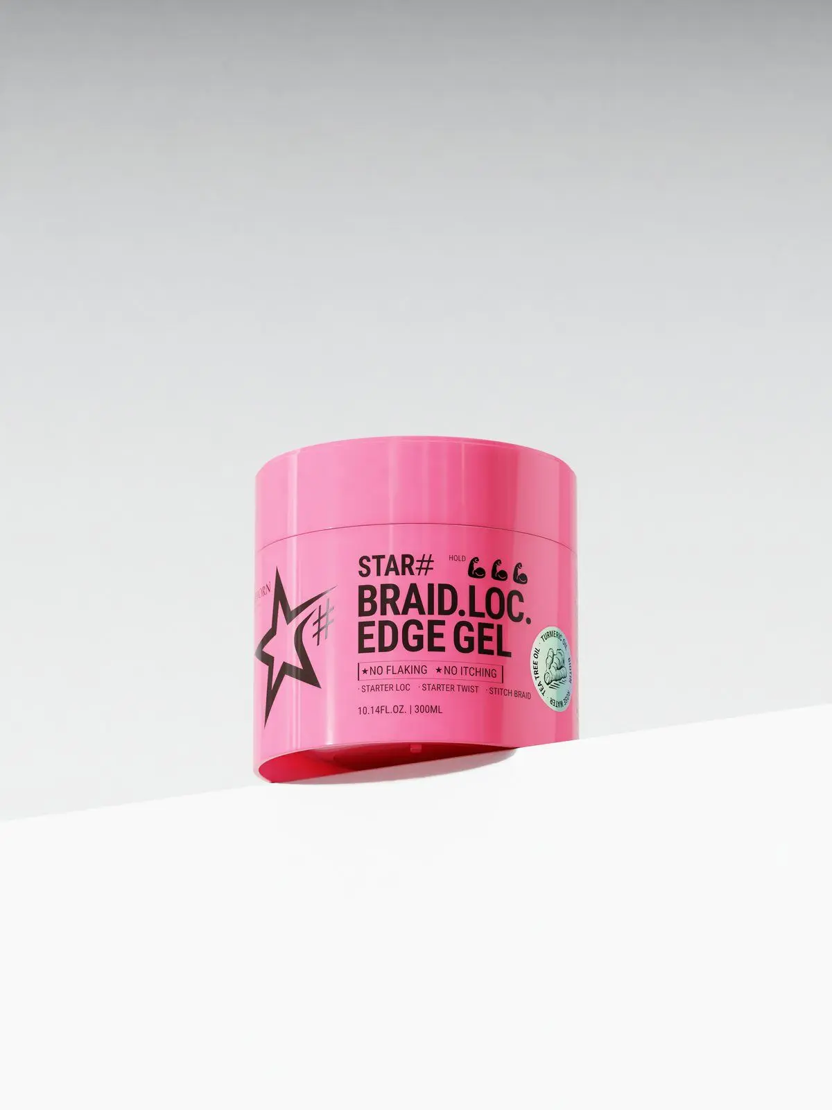 Pink CELLREBORN STAR# Braid Loc Edge Gel jar on a white ledge against a grey backdrop